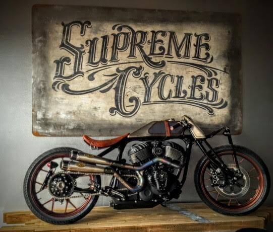Painted Supreme Cycles sign