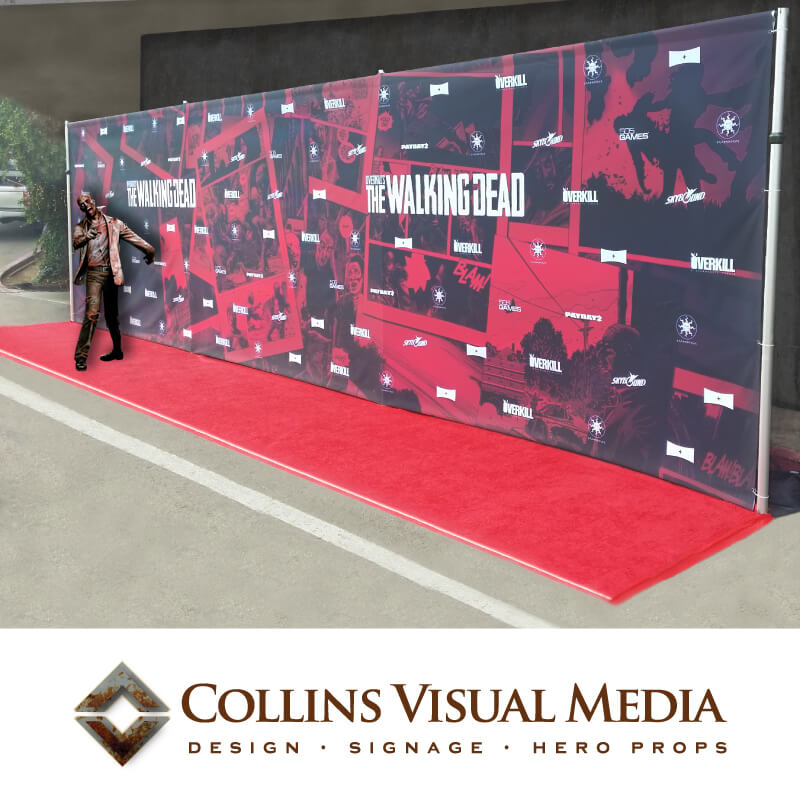 A large, Walking Dead themed step and repeat backdrop