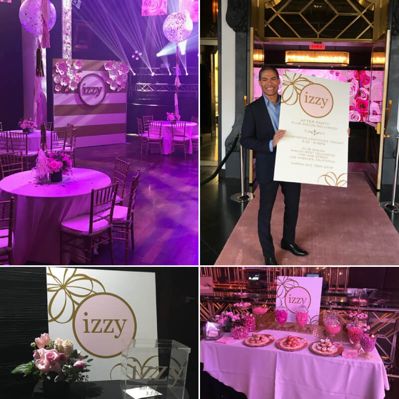 An attractive photo backdrop and tons of signage for Izzy's Bat Mitzvah