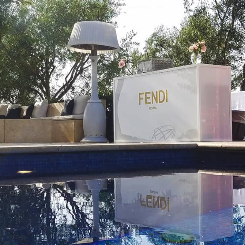 A custom DJ booth with gold vinyl lettering for Fendi Roma's party